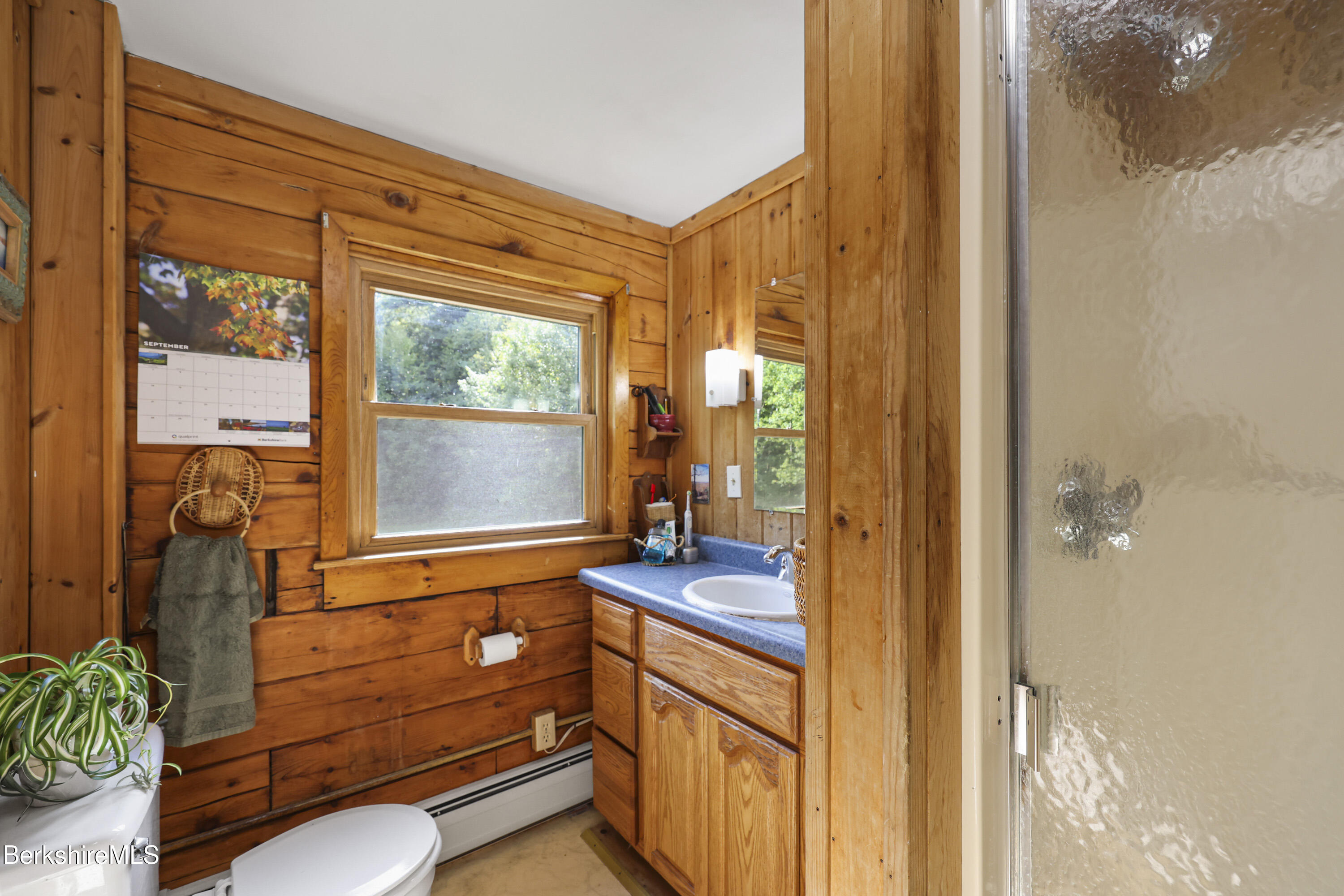 78 East Main Road Peru, MA 01235 - Photo 37 of 56 a bathroom with a sink a mirror and next to a window