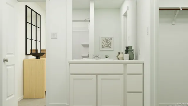 a bathroom with a sink and a mirror