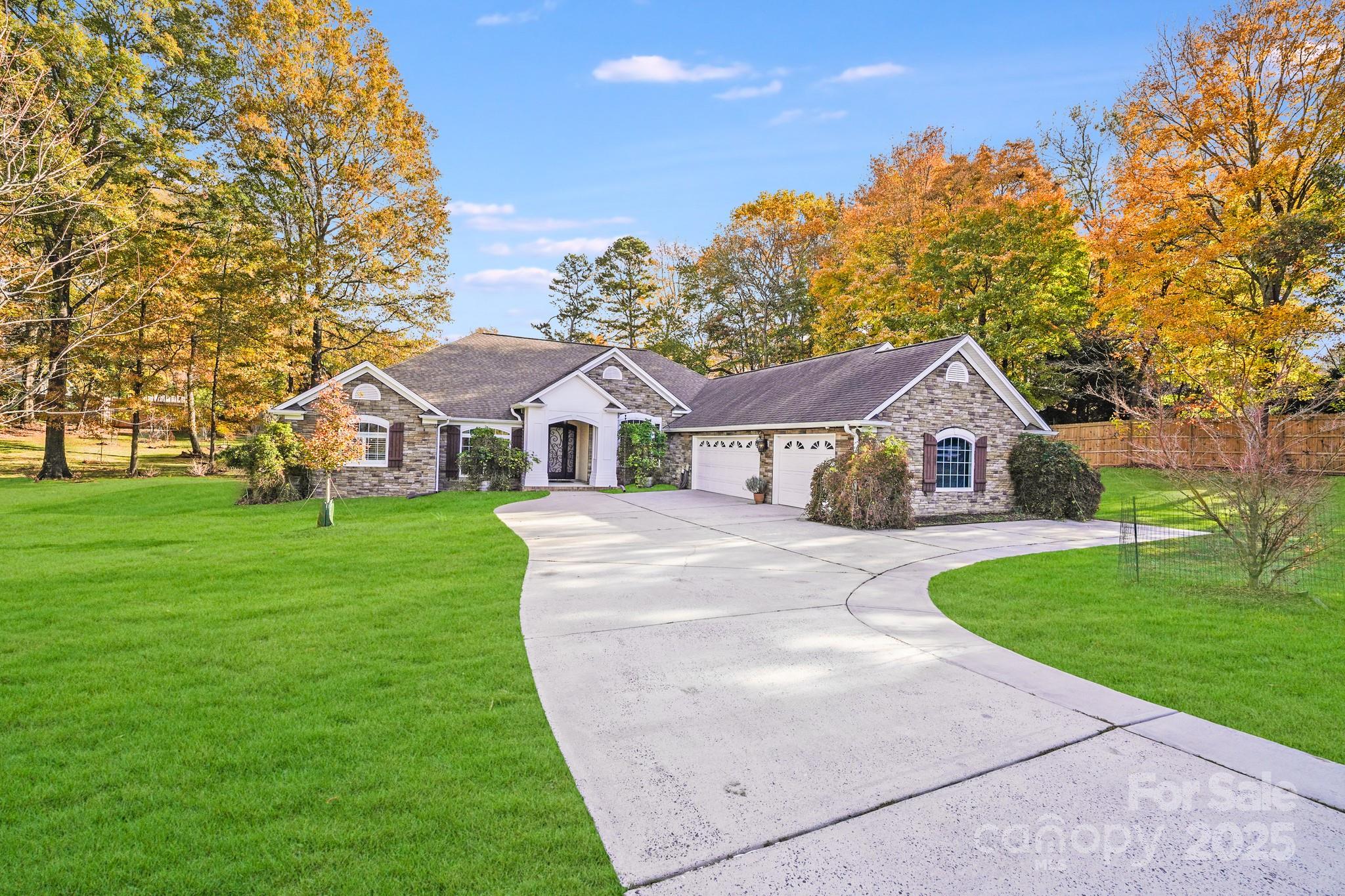 5329 Kuykendall Road Charlotte, NC 28270 - Photo 1 of 18 a front view of a house with garden