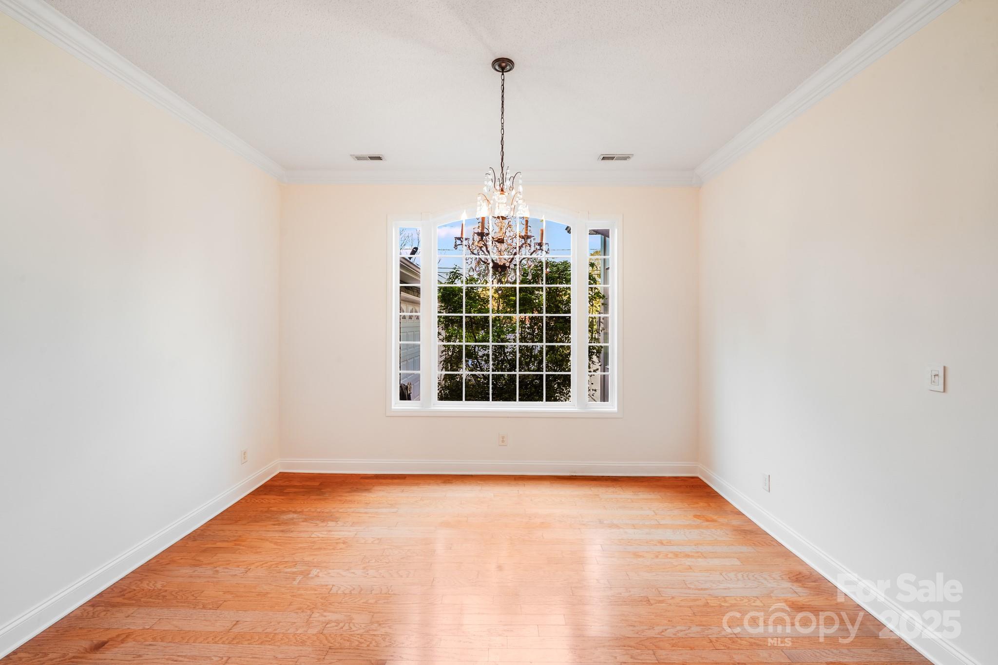 5329 Kuykendall Road Charlotte, NC 28270 - Photo 11 of 18 a view of an empty room with windows