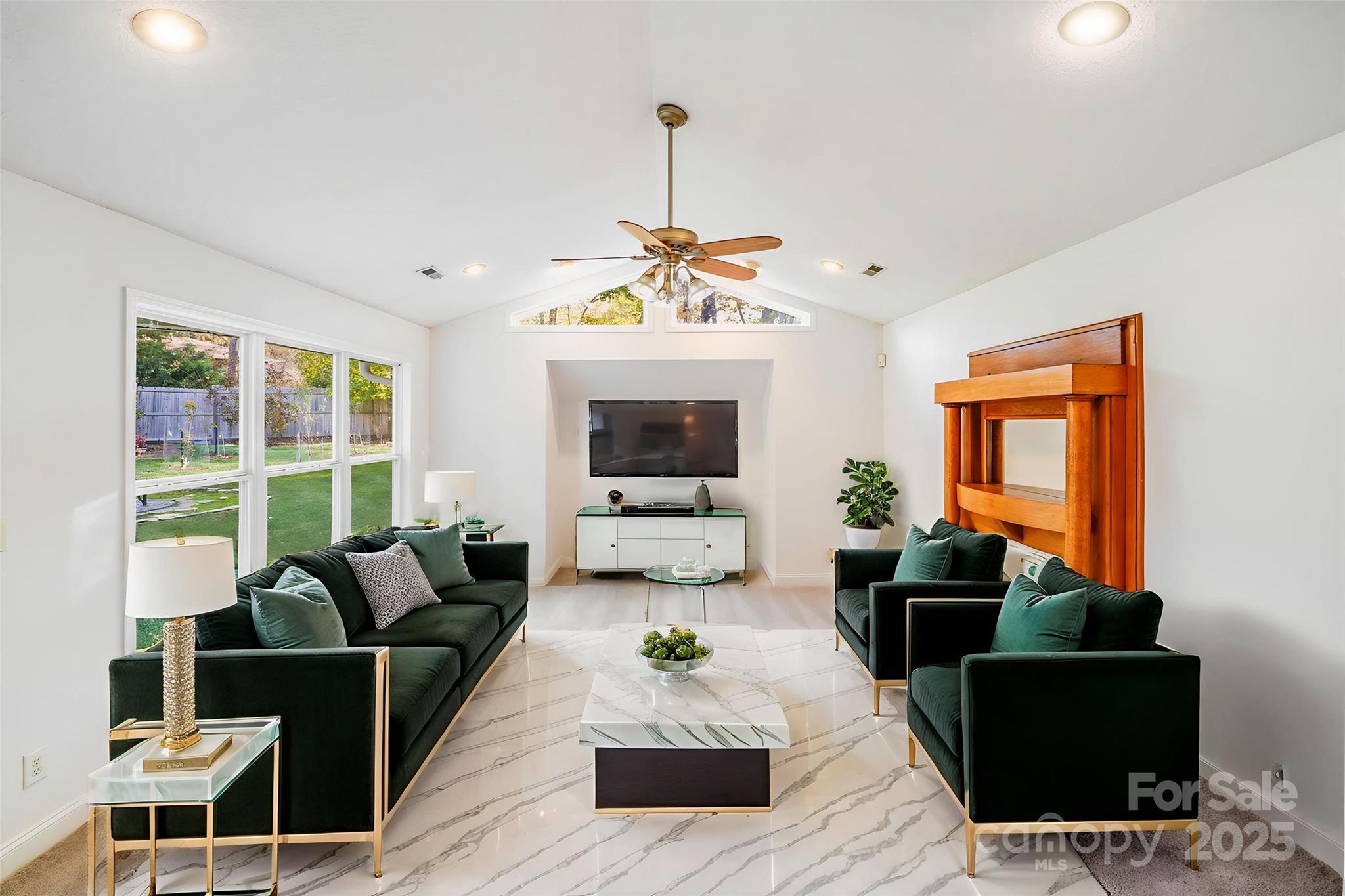 5329 Kuykendall Road Charlotte, NC 28270 - Photo 12 of 18 a living room with furniture a flat screen tv and a large window