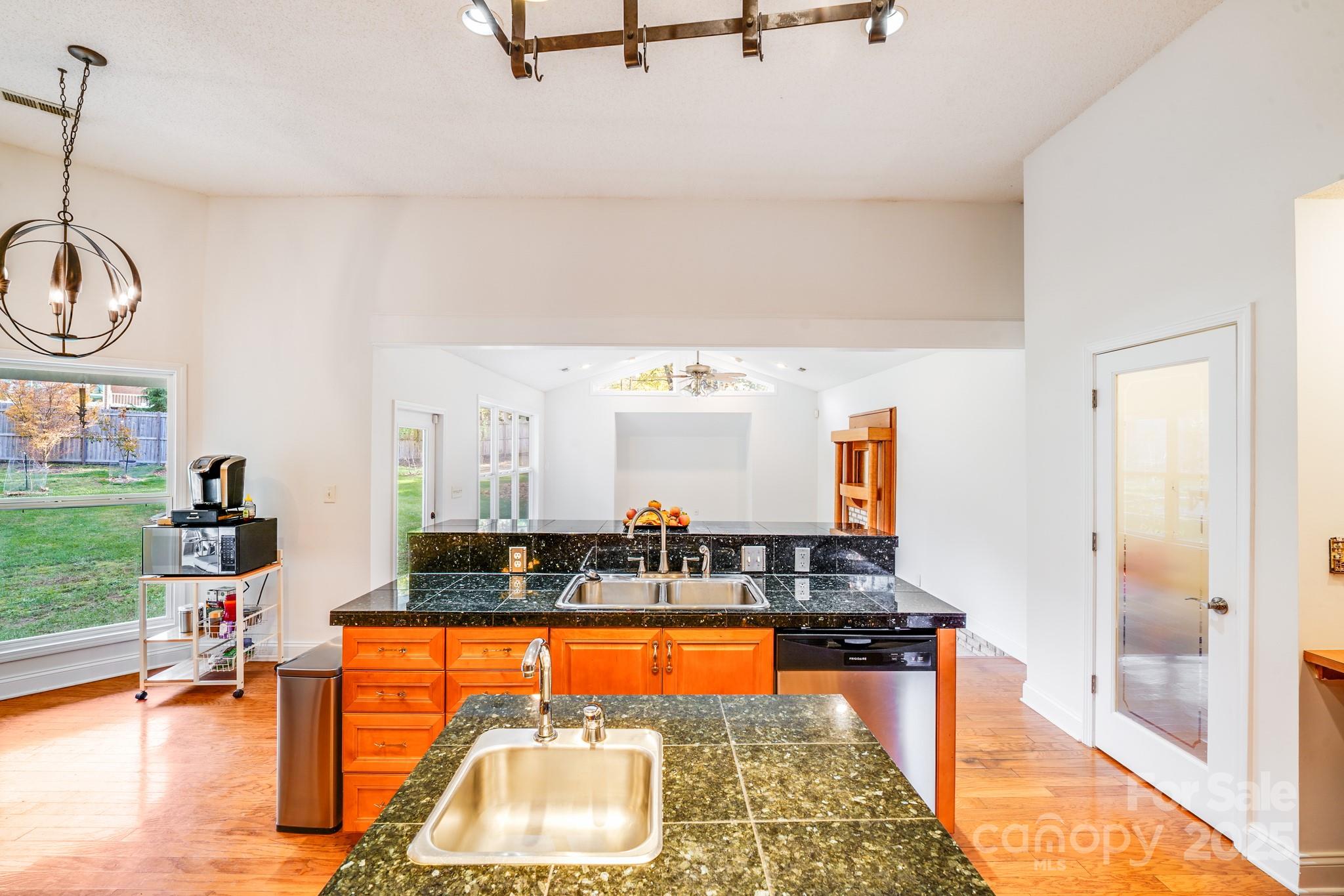 5329 Kuykendall Road Charlotte, NC 28270 - Photo 15 of 18 a living room with furniture a rug and a flat screen tv