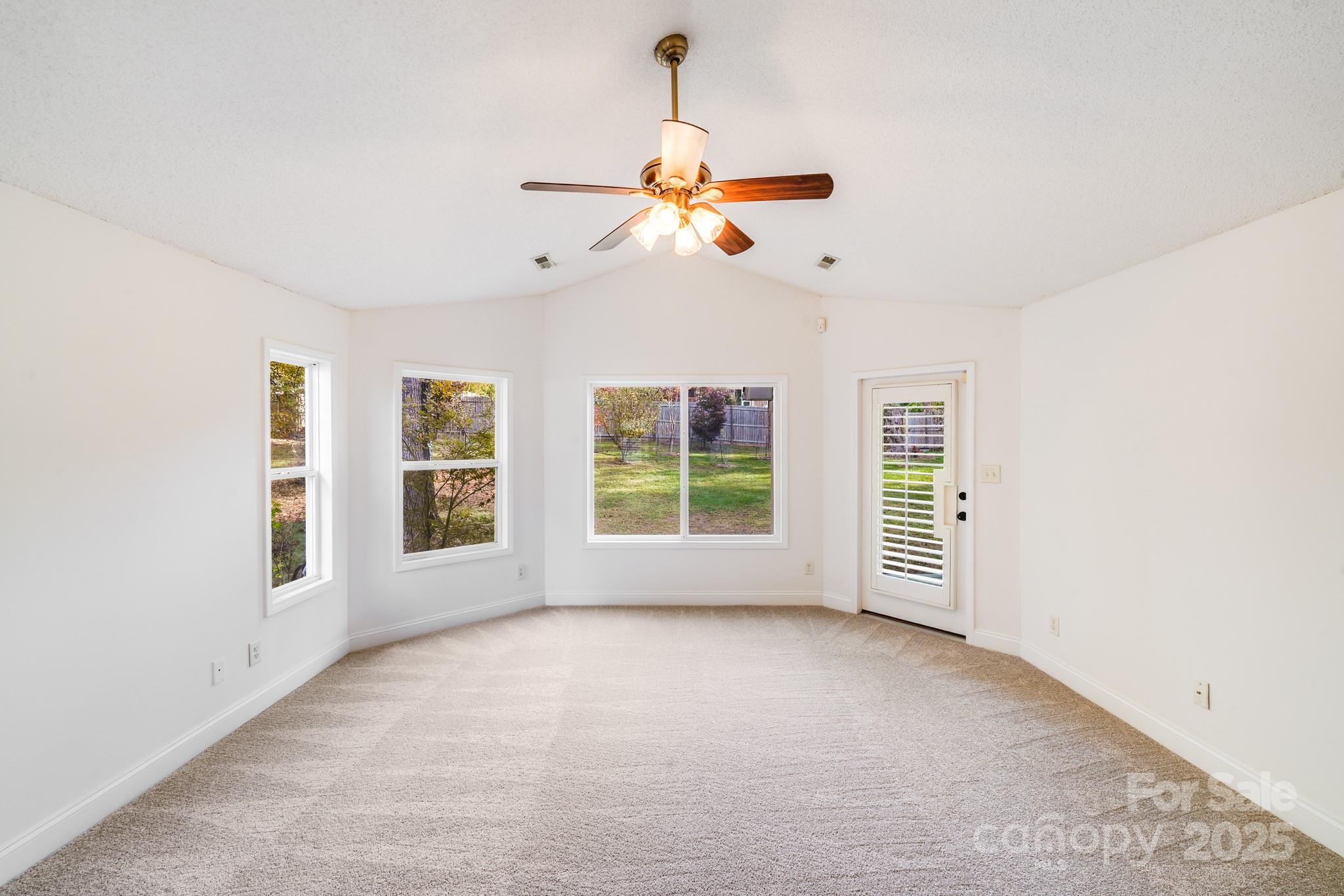 5329 Kuykendall Road Charlotte, NC 28270 - Photo 18 of 18 an empty room with windows and fan