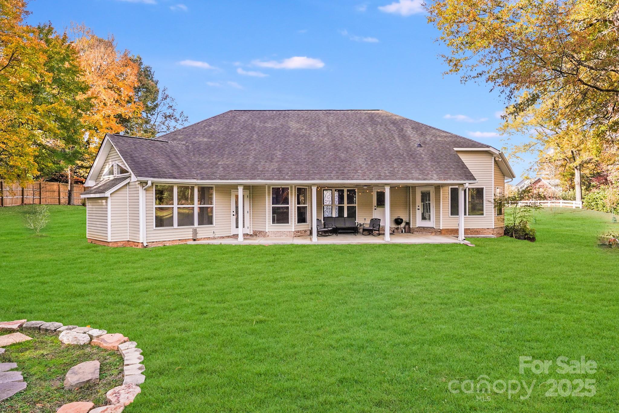 5329 Kuykendall Road Charlotte, NC 28270 - Photo 6 of 18 a front view of a house with a garden
