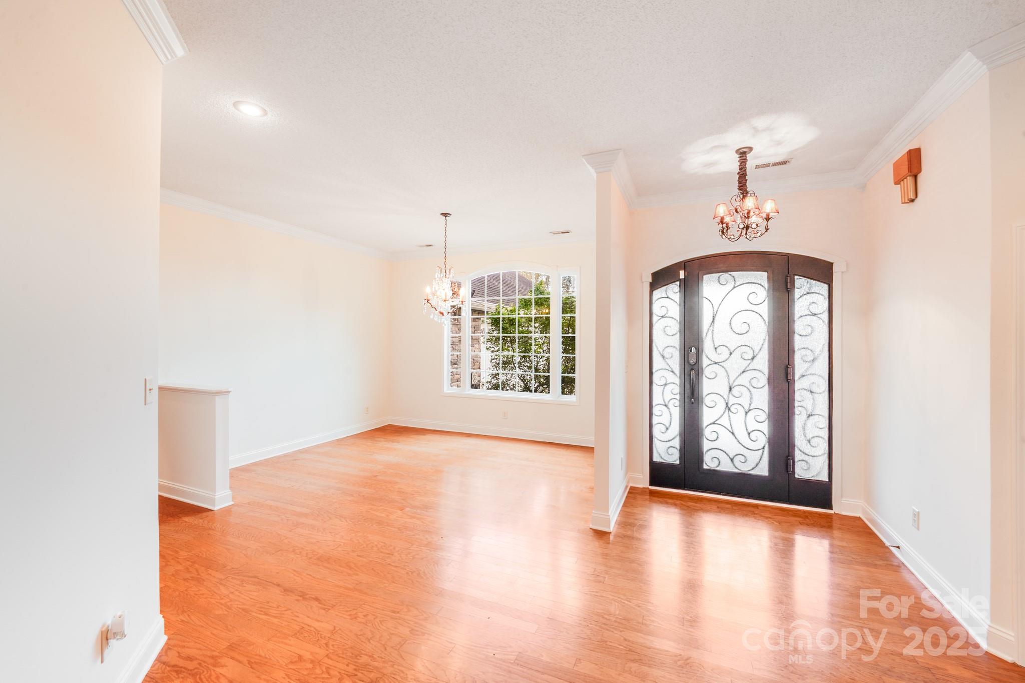 5329 Kuykendall Road Charlotte, NC 28270 - Photo 9 of 18 wooden floor in an empty room with a window