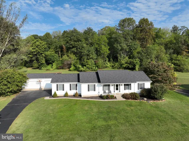 a view of a house with a big yard