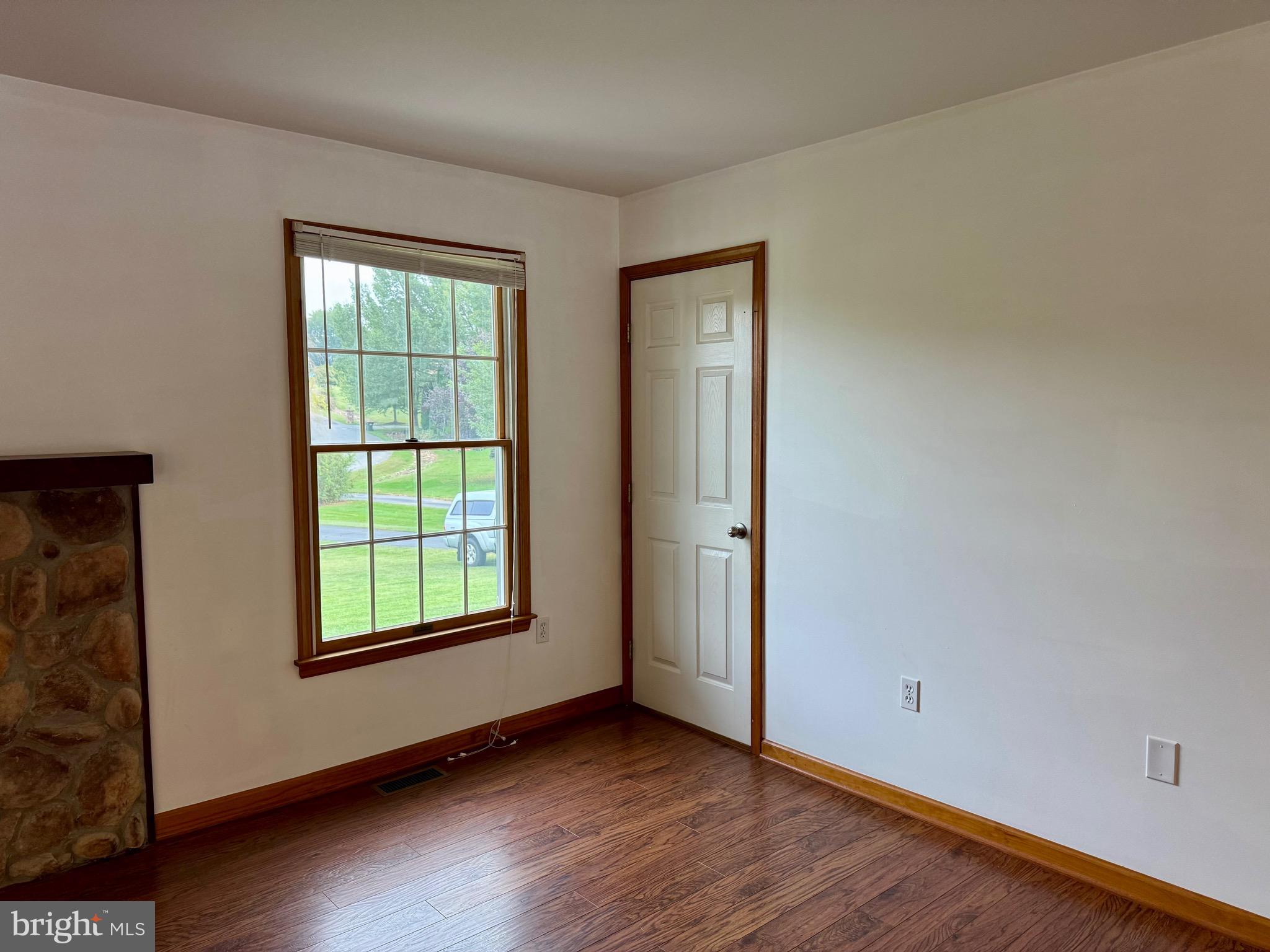 35 Coachman Drive Rising Sun, MD 21911 - Photo 18 of 58 an empty room with wooden floor and windows