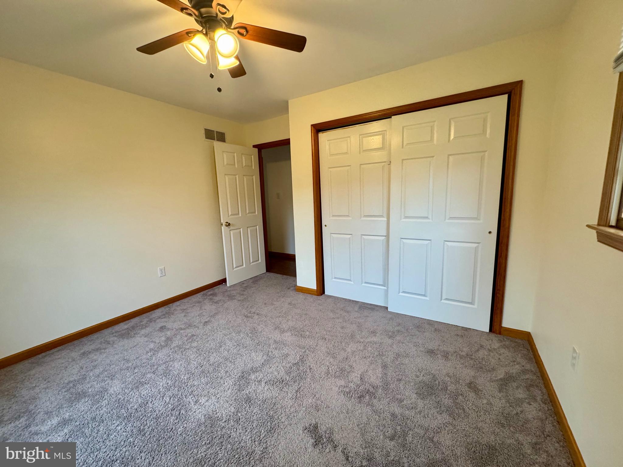 35 Coachman Drive Rising Sun, MD 21911 - Photo 33 of 58 an empty room with closet and a chandelier fan