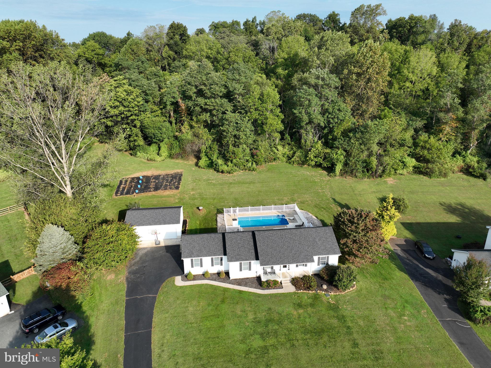 35 Coachman Drive Rising Sun, MD 21911 - Photo 9 of 58 a view of a swimming pool with a garden