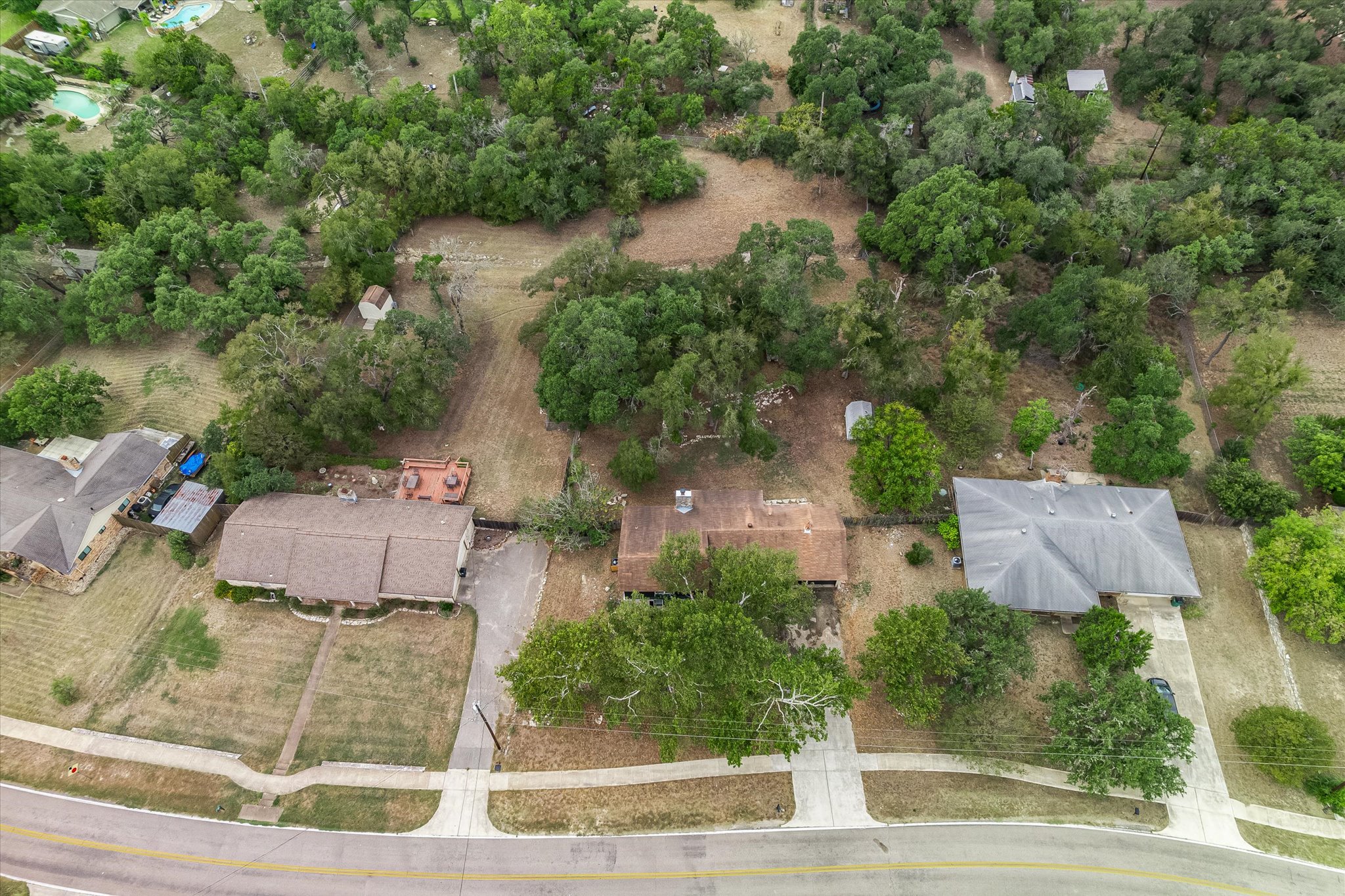 8806 El Rey Boulevard Austin, TX 78737 - Photo 29 of 38 an aerial view of a house with outdoor space and street view