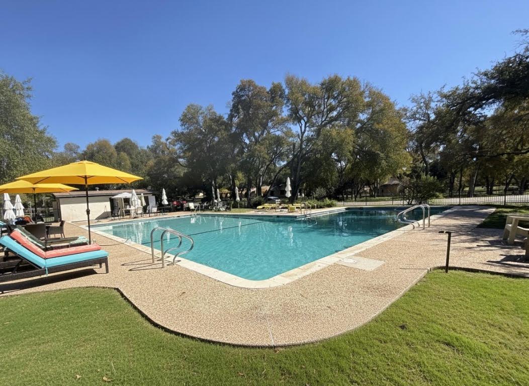 8806 El Rey Boulevard Austin, TX 78737 - Photo 34 of 35 Community pool featuring a patio area.