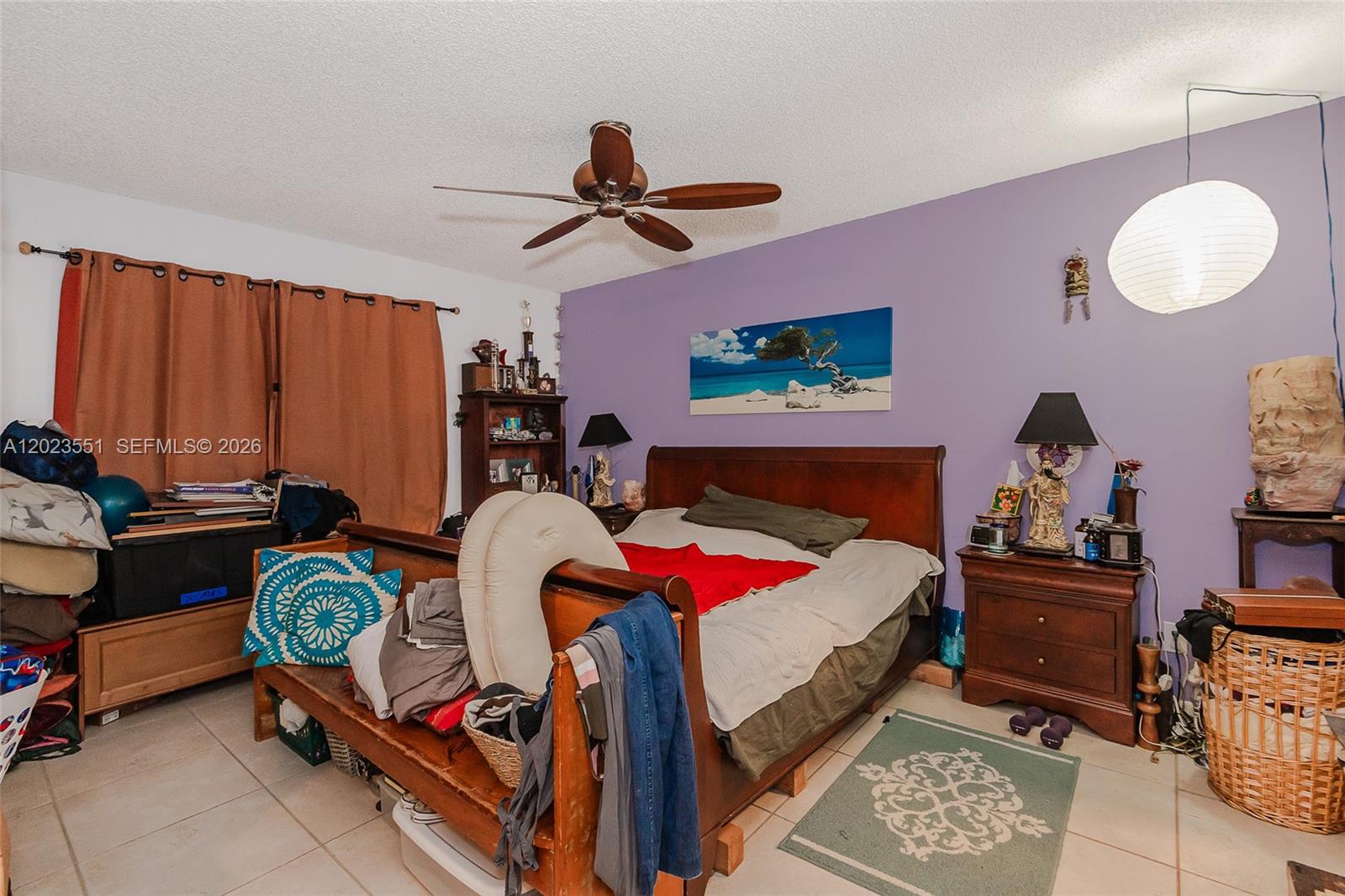 11482 Southwest 109th Road, Unit 29A Miami, FL 33176 - Photo 14 of 28 a bedroom with a bed and a chandelier