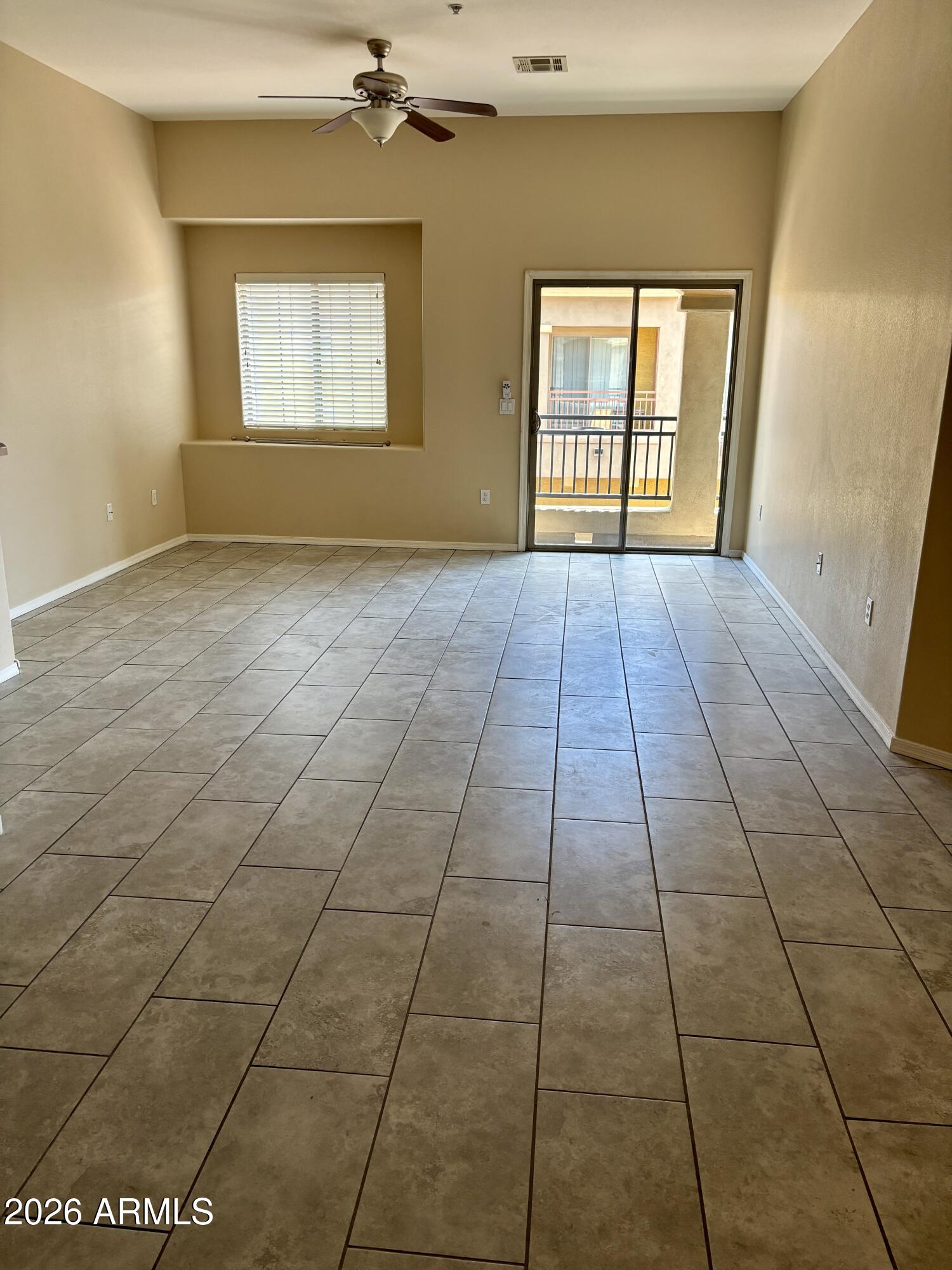 17150 North 23rd Street, Unit 211 Phoenix, AZ 85022 - Photo 4 of 9 a view of an empty room with a window