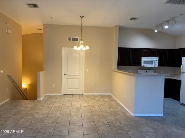 a view of a livingroom with a kitchen