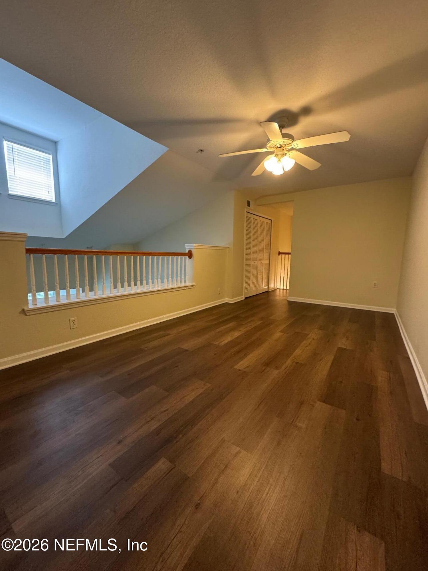 8550 Touchton Road, Unit 1727 Jacksonville, FL 32216 - Photo 14 of 15 a view of an empty room with window and chandelier fan