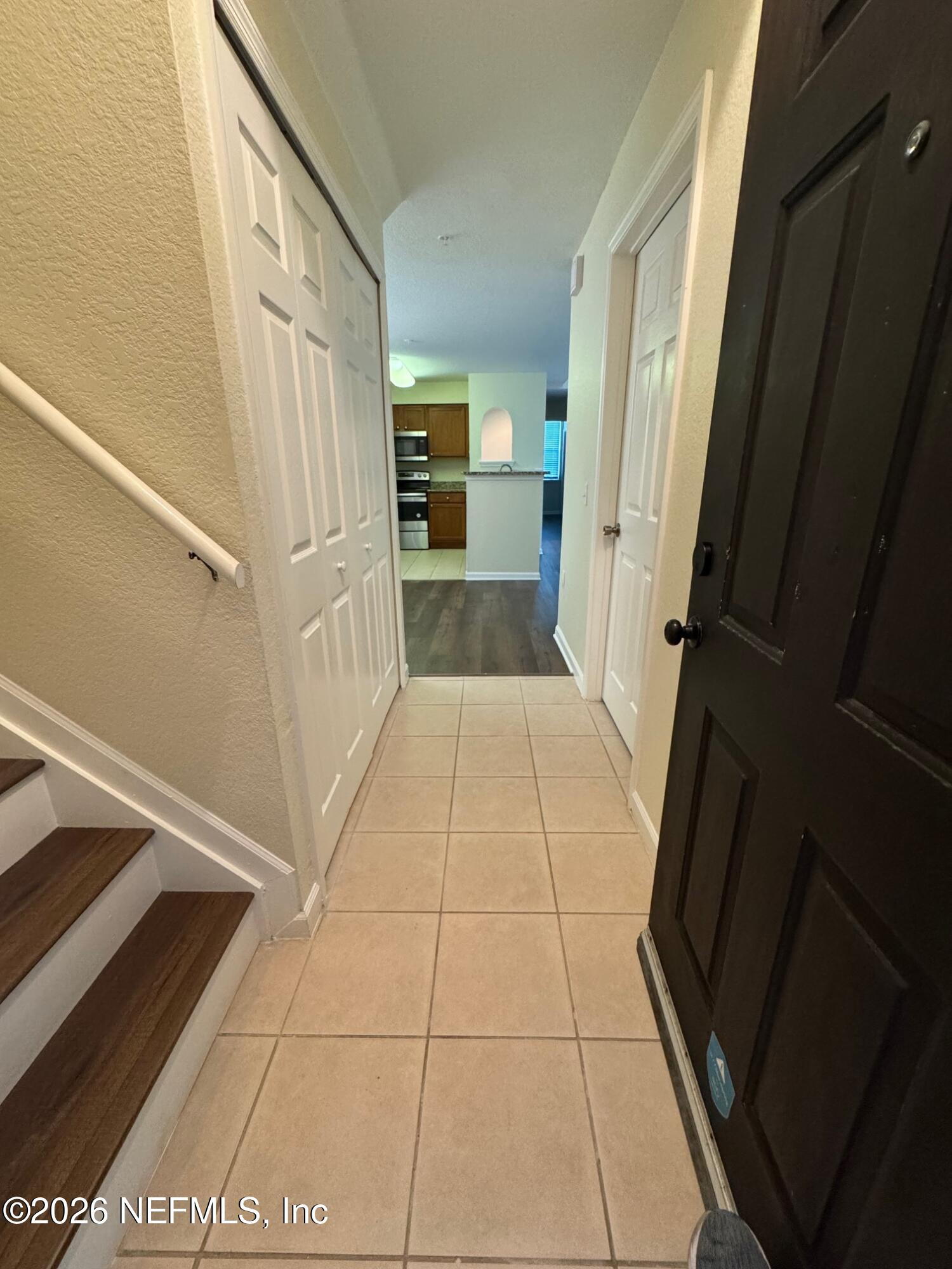 8550 Touchton Road, Unit 1727 Jacksonville, FL 32216 - Photo 2 of 15 a view of a hallway to rooms and stairs