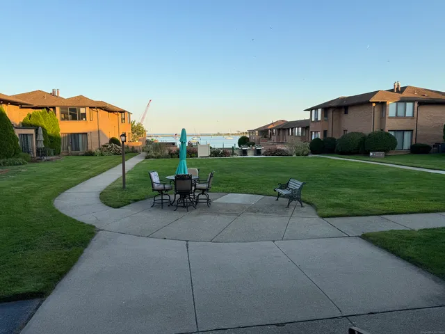 a view of a house with a backyard and a garden