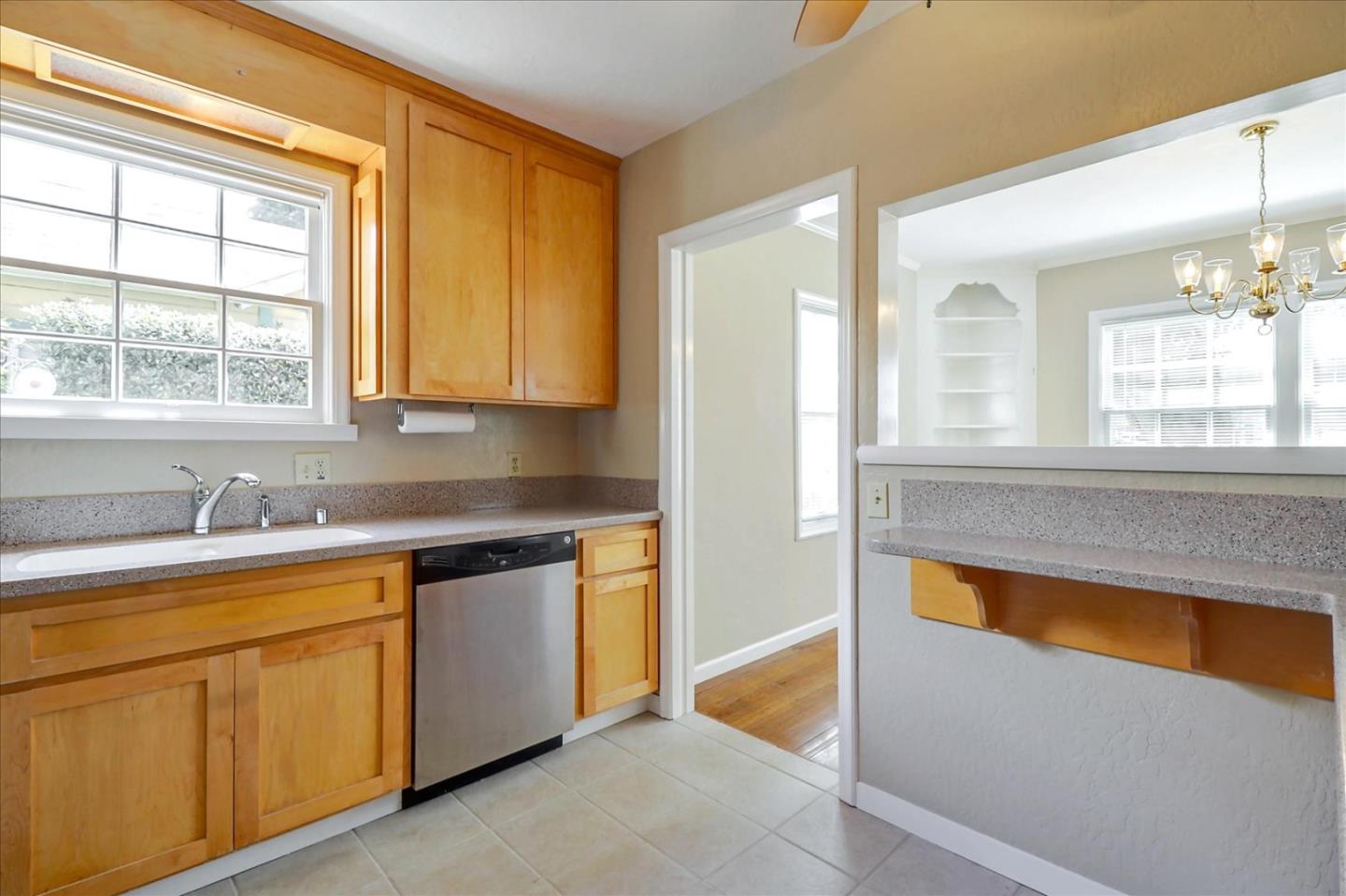 420 Sunset Boulevard Hayward, CA 94541 - Photo 12 of 51 a kitchen with a sink window and cabinets