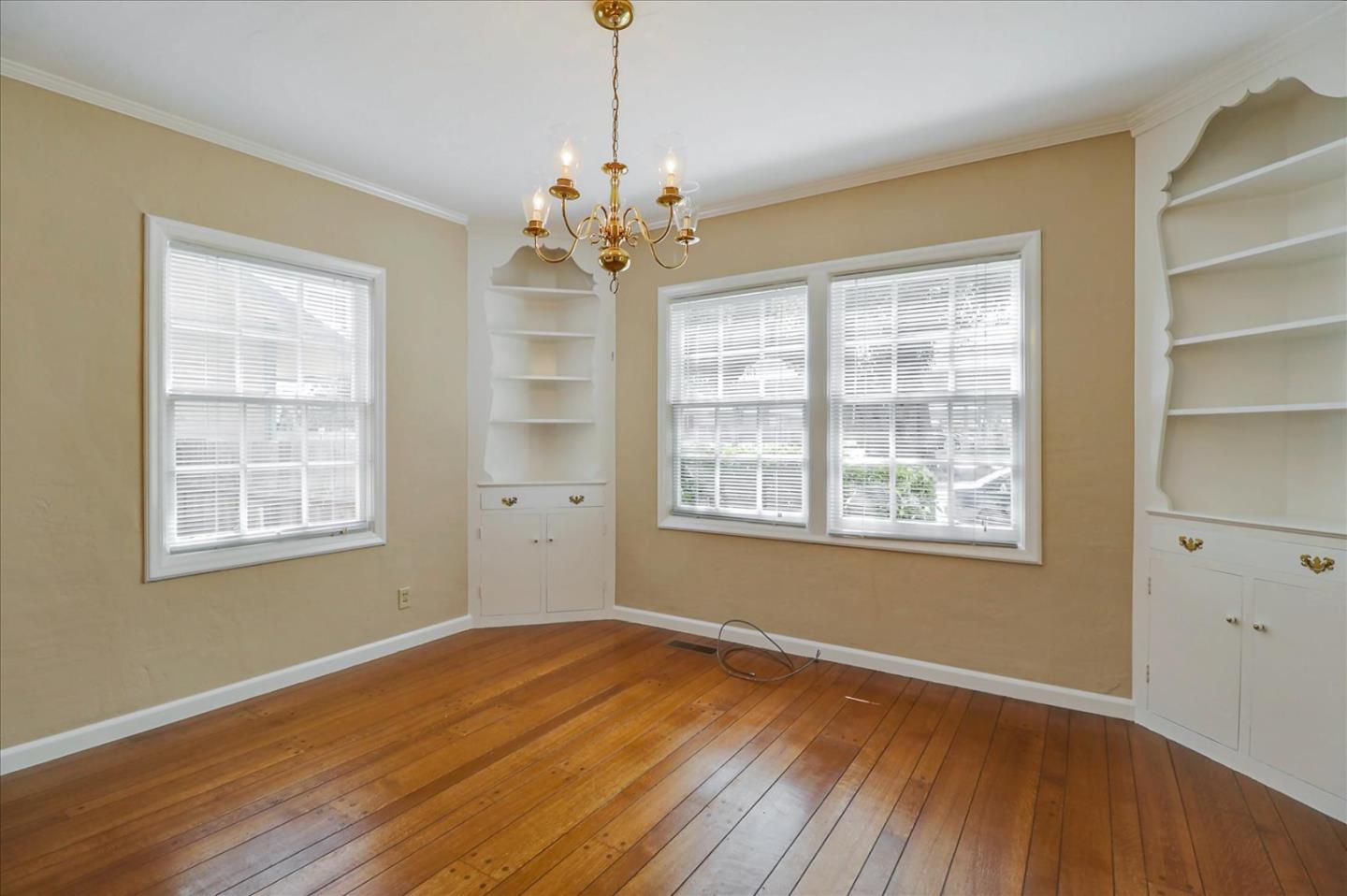420 Sunset Boulevard Hayward, CA 94541 - Photo 13 of 51 a view of an empty room with wooden floor and a window