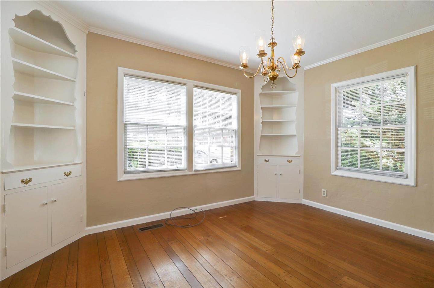 420 Sunset Boulevard Hayward, CA 94541 - Photo 14 of 51 a view of an empty room with a window and wooden floor