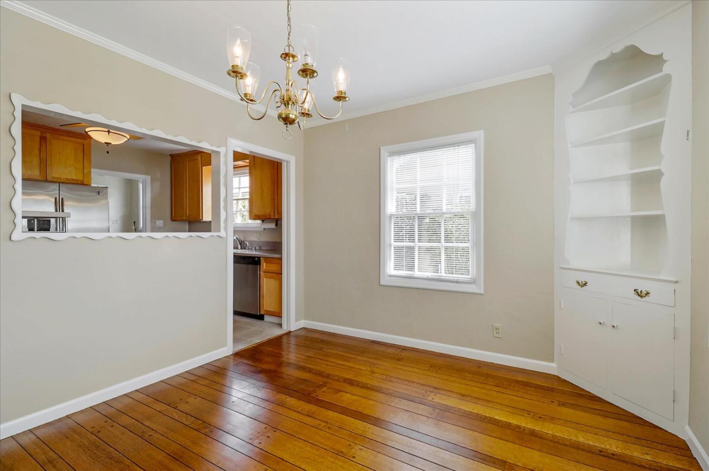 420 Sunset Boulevard Hayward, CA 94541 - Photo 15 of 51 a view of an empty room with a window and wooden floor