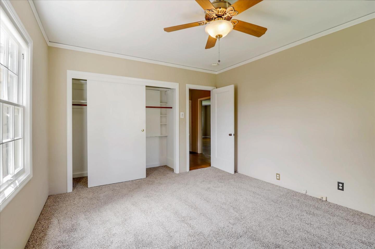 420 Sunset Boulevard Hayward, CA 94541 - Photo 20 of 51 an empty room with a ceiling fan and a window