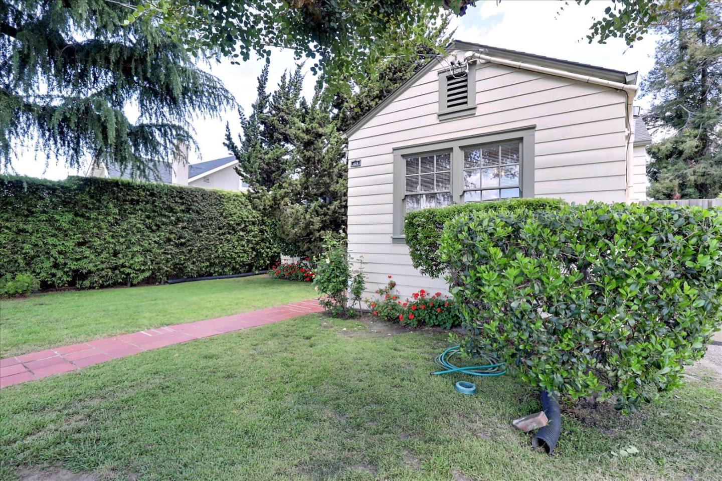420 Sunset Boulevard Hayward, CA 94541 - Photo 3 of 51 a view of a backyard with plants and palm trees