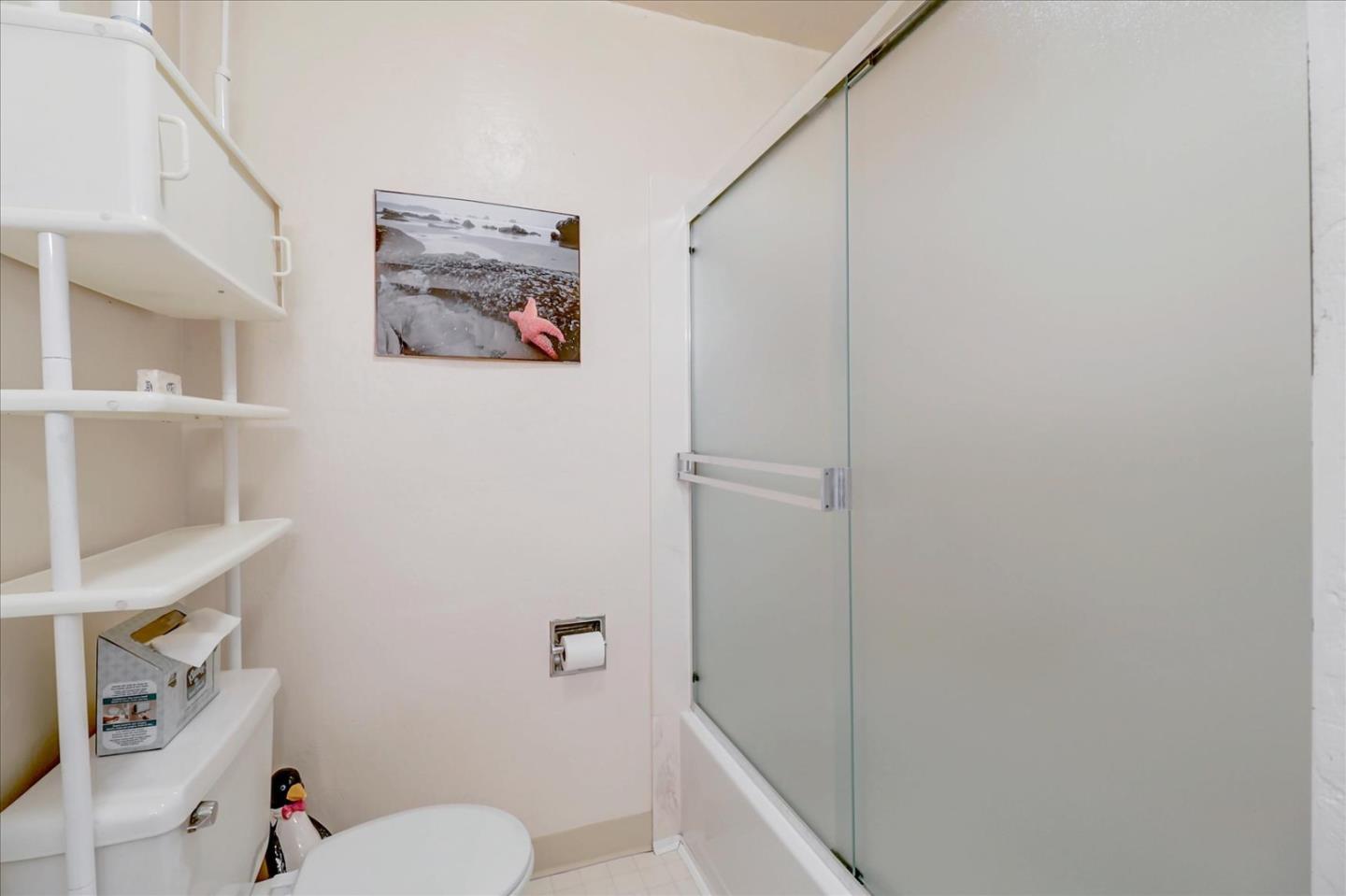 420 Sunset Boulevard Hayward, CA 94541 - Photo 32 of 51 a bathroom with a toilet and a shower curtain