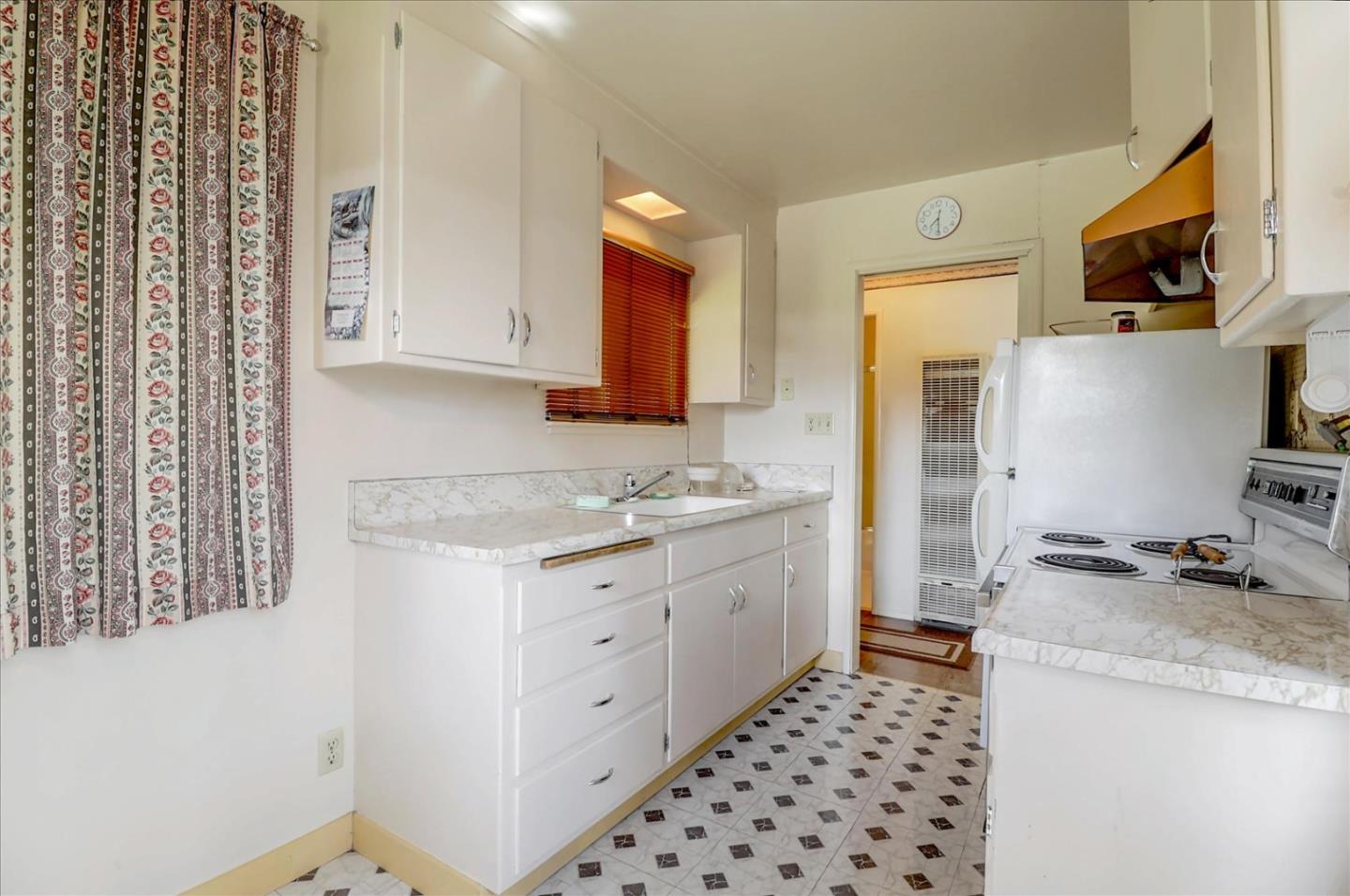 420 Sunset Boulevard Hayward, CA 94541 - Photo 37 of 51 a kitchen with granite countertop a sink stove and refrigerator