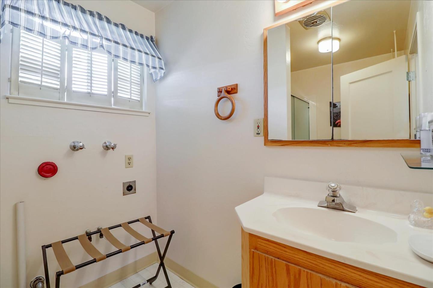 420 Sunset Boulevard Hayward, CA 94541 - Photo 41 of 51 a bathroom with a sink and a mirror