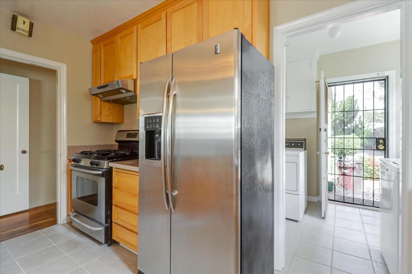 420 Sunset Boulevard Hayward, CA 94541 - Photo 10 of 51 a kitchen with stainless steel appliances granite countertop a refrigerator and a stove