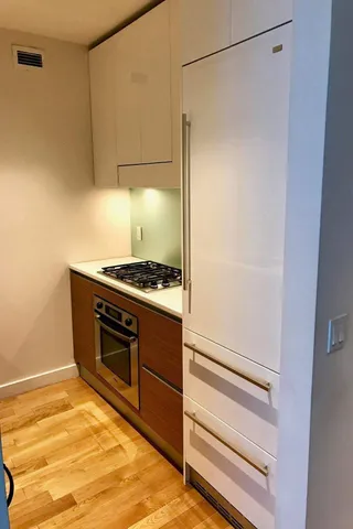 a kitchen with a stove and a refrigerator