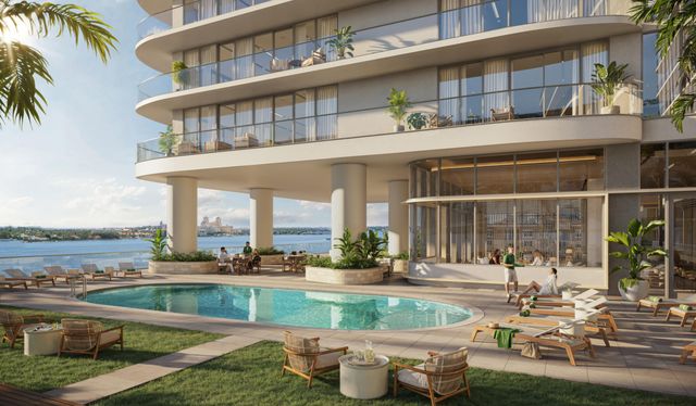 a view of a building with a swimming pool and a chairs