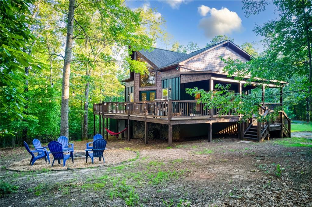 774 Kelly Ridge Drive Blue Ridge, GA 30513 - Photo 17 of 99 a view of a house with a backyard and patio