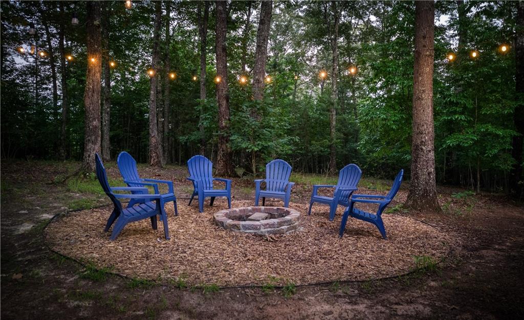 774 Kelly Ridge Drive Blue Ridge, GA 30513 - Photo 18 of 99 a view of a chairs in a backyard