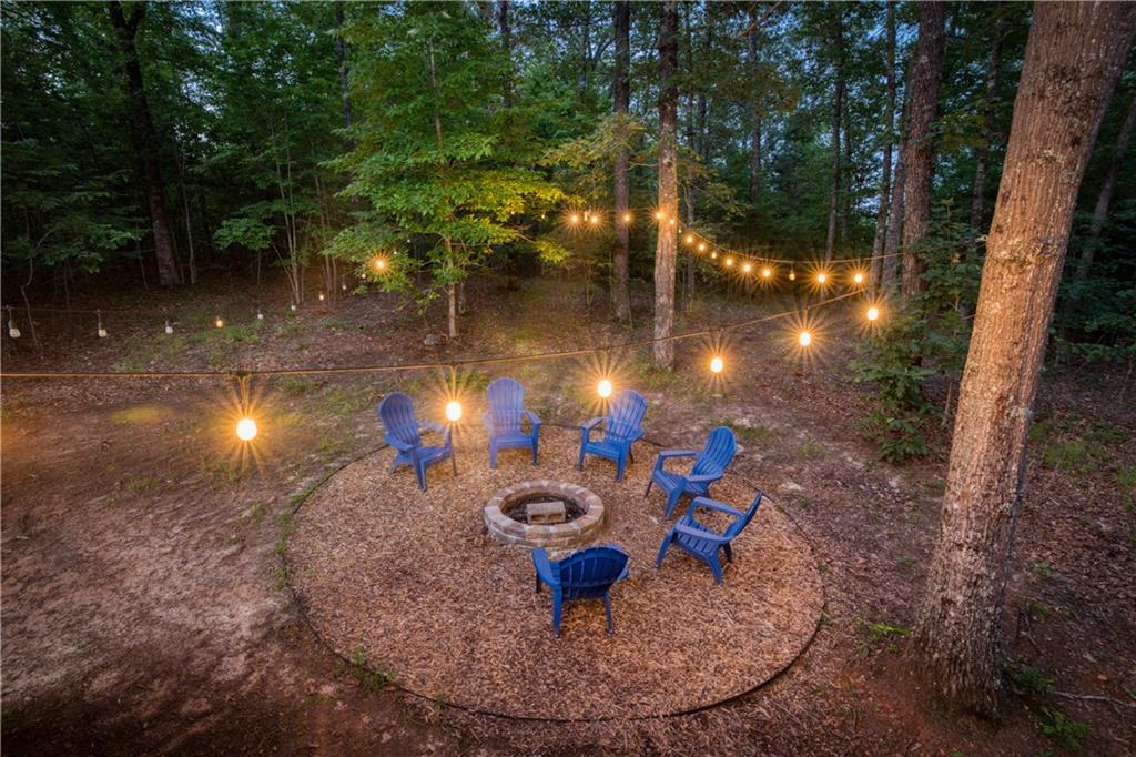 774 Kelly Ridge Drive Blue Ridge, GA 30513 - Photo 21 of 99 a view of a backyard of a house with fire pit