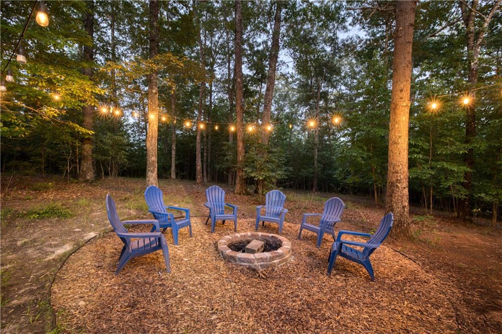 774 Kelly Ridge Drive Blue Ridge, GA 30513 - Photo 23 of 99 a backyard of a house with outdoor seating