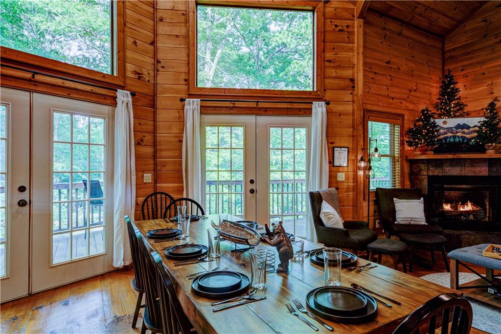 774 Kelly Ridge Drive Blue Ridge, GA 30513 - Photo 30 of 99 a dining room with furniture and a fireplace
