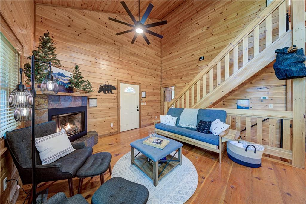 774 Kelly Ridge Drive Blue Ridge, GA 30513 - Photo 33 of 99 a living room with furniture and a fireplace