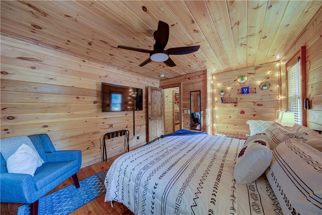 774 Kelly Ridge Drive Blue Ridge, GA 30513 - Photo 38 of 99 a bed room with a bed window and a chair