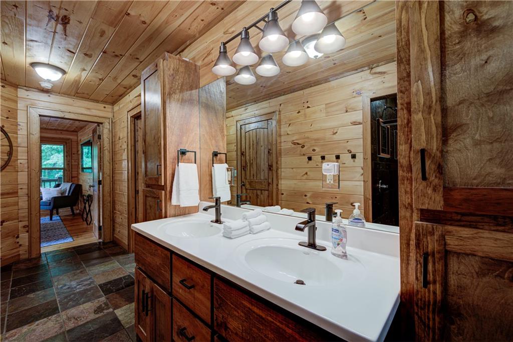 774 Kelly Ridge Drive Blue Ridge, GA 30513 - Photo 41 of 99 a bathroom with a sink and a mirror