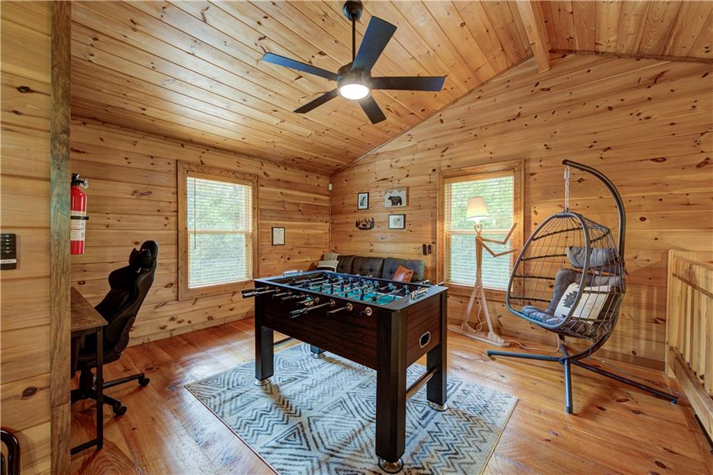 774 Kelly Ridge Drive Blue Ridge, GA 30513 - Photo 44 of 99 a living room with furniture a rug and a window