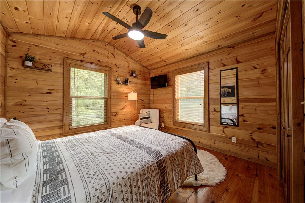 774 Kelly Ridge Drive Blue Ridge, GA 30513 - Photo 49 of 99 a bedroom with a large bed and a large window