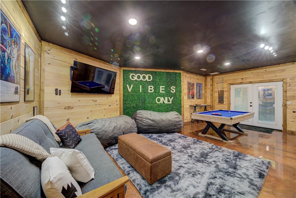 774 Kelly Ridge Drive Blue Ridge, GA 30513 - Photo 54 of 99 a living room with furniture and a flat screen tv