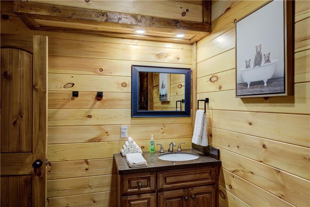 774 Kelly Ridge Drive Blue Ridge, GA 30513 - Photo 59 of 99 a bathroom with a sink and a mirror