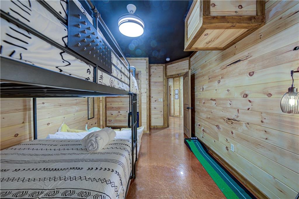 774 Kelly Ridge Drive Blue Ridge, GA 30513 - Photo 62 of 99 a large bedroom with a bed and wooden floor