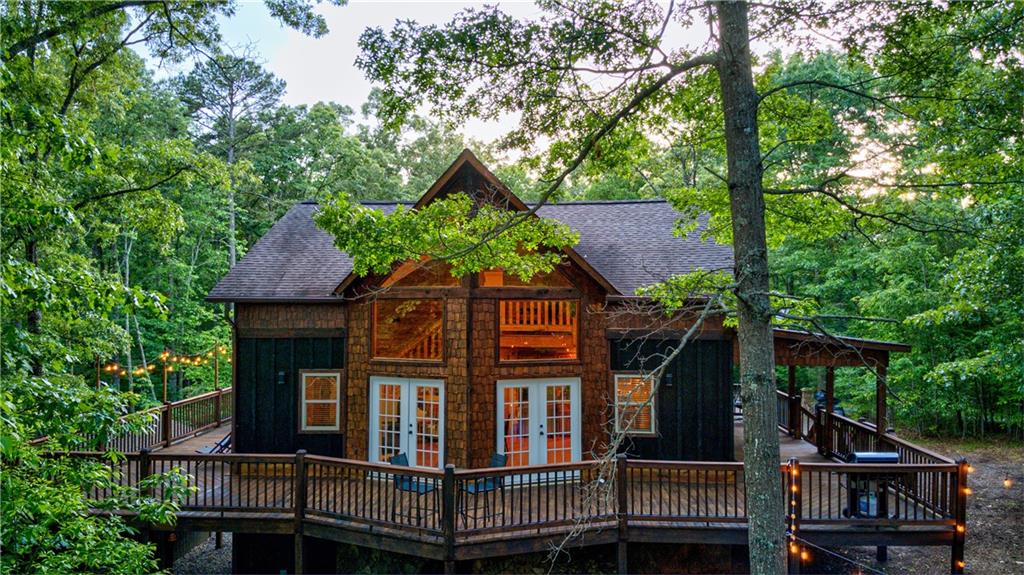 774 Kelly Ridge Drive Blue Ridge, GA 30513 - Photo 89 of 99 a front view of a house with a garden