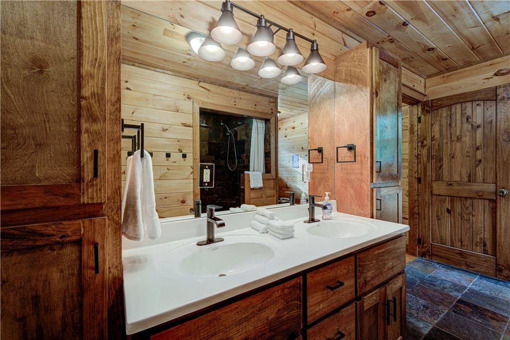 774 Kelly Ridge Drive Blue Ridge, GA 30513 - Photo 9 of 99 a bathroom with a sink and a mirror