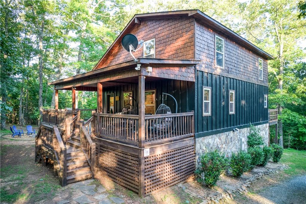 774 Kelly Ridge Drive Blue Ridge, GA 30513 - Photo 94 of 99 a view of house with a chairs in the patio