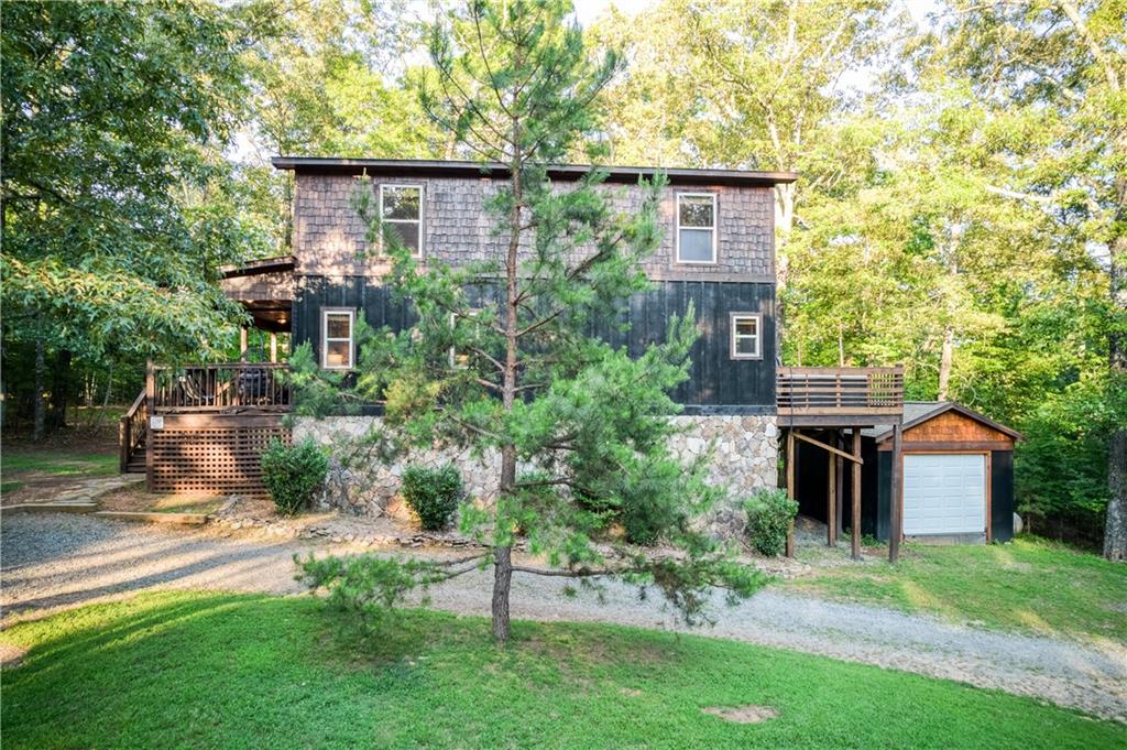 774 Kelly Ridge Drive Blue Ridge, GA 30513 - Photo 96 of 99 a view of a house with a yard and plants
